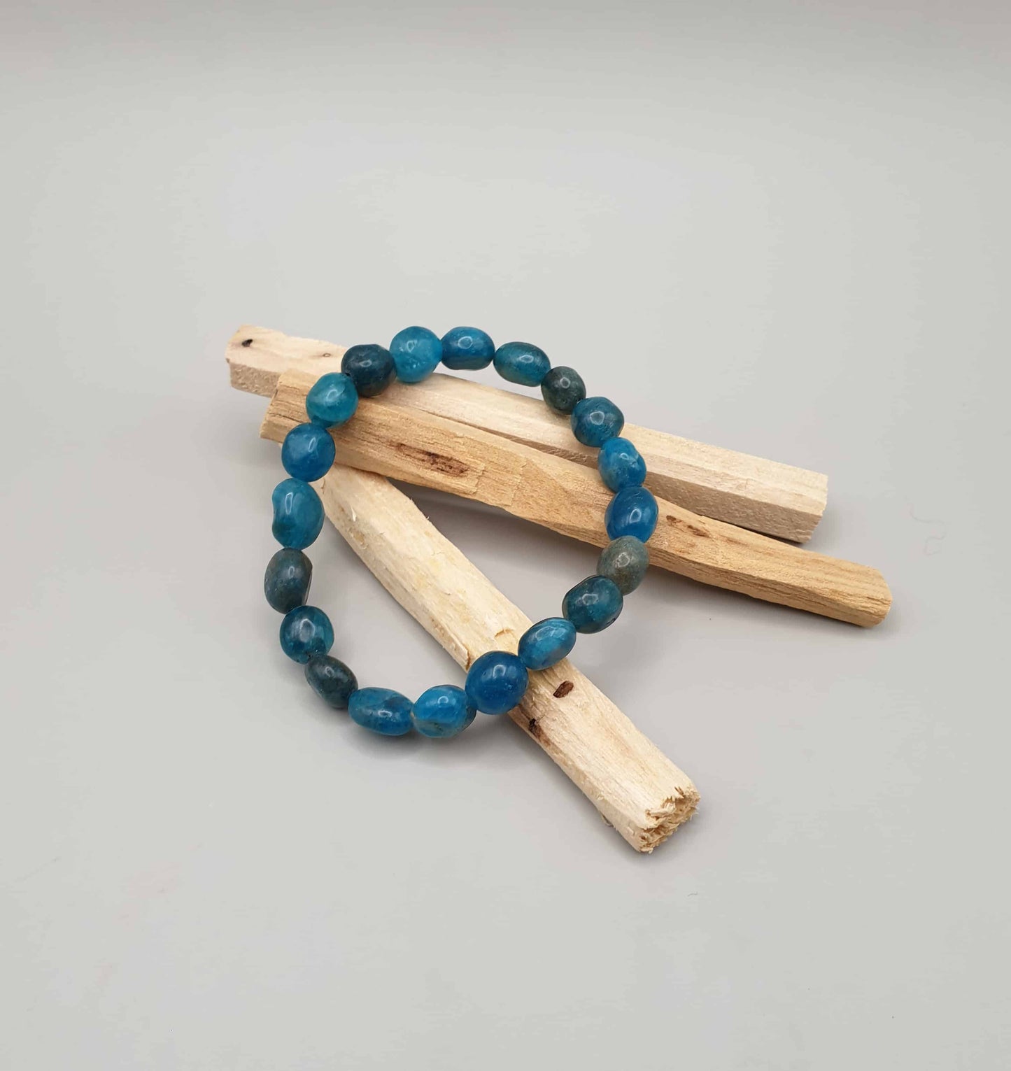 A Blue Apatite tumbled stone bracelet can aid its wearer with opening lines of communication and social ease, it can also assist with drawing off negativity about oneself and others. This beautiful stone is also believed to be beneficial for hyperactive and autistic children, balancing emotionally and mentally.  Beads measure 8/10mm Circumference is approximately 6.5 inches. Bracelet is elasticated.