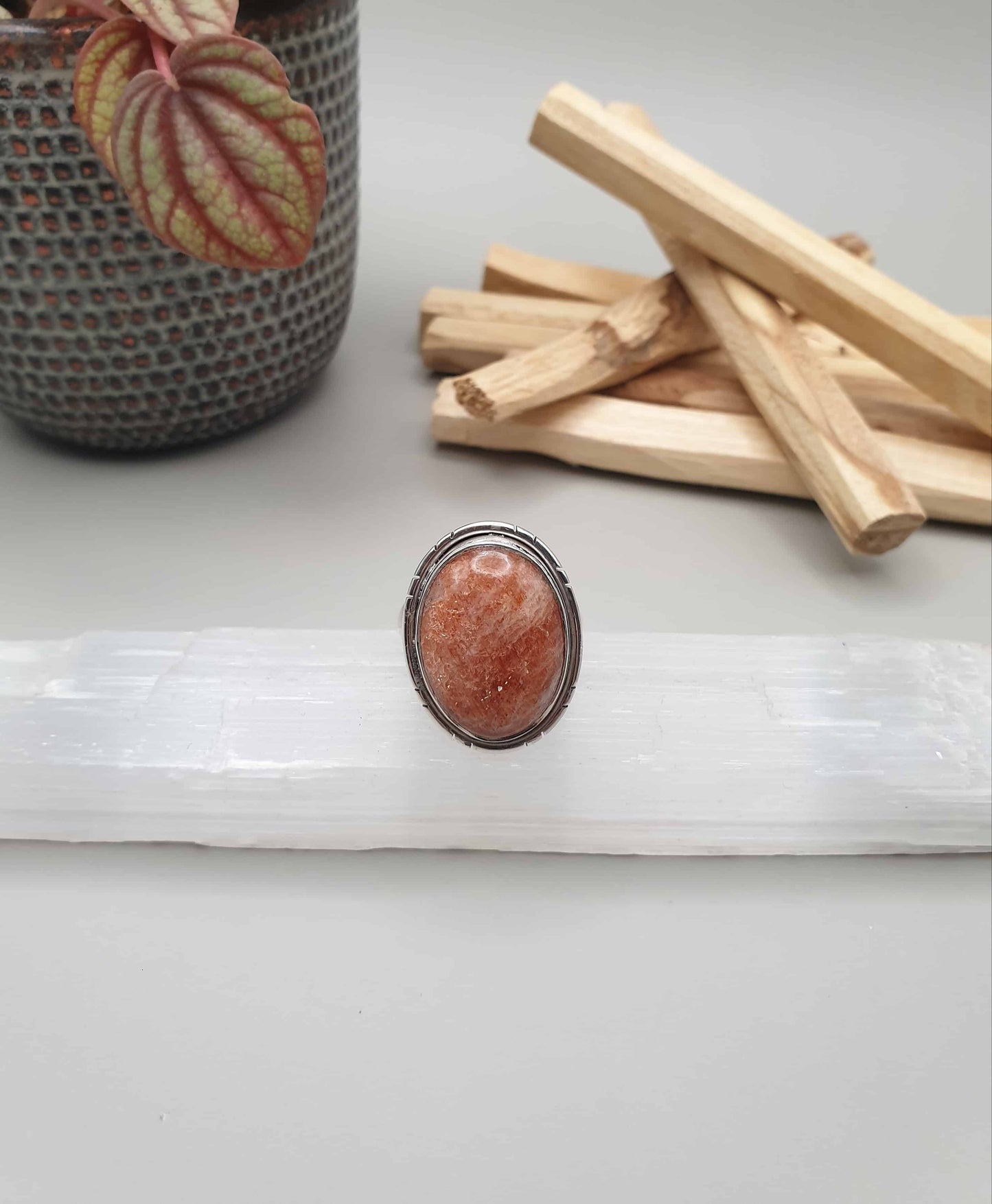 Sunstone, representing the sun, an energetic source of light and warmth, believed to be linked to luck and fortune, can assist in aligning the mind and the body, just like a day in the sun! Handcrafted in India using 925 sterling silver Natural sunstone adjustable ring sits at around a size 8 but can be adjusted either way.