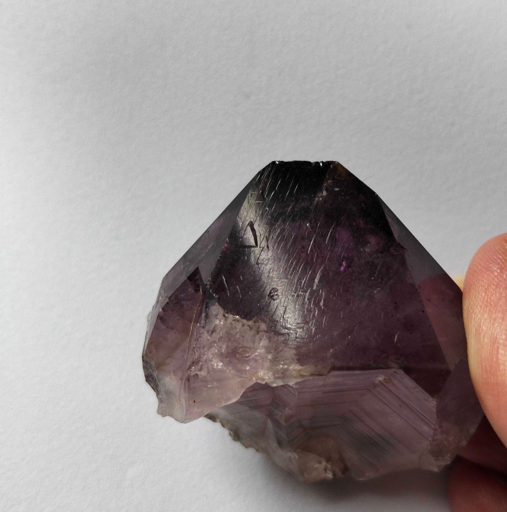 Australian Amethyst crystal, adorned with inclusions, record keepers and zoning of amethyst, showcase the unique geological processes at play. Unearthed from this distinctive Australian mine, each amethyst point holds a piece of history and inherent beauty.