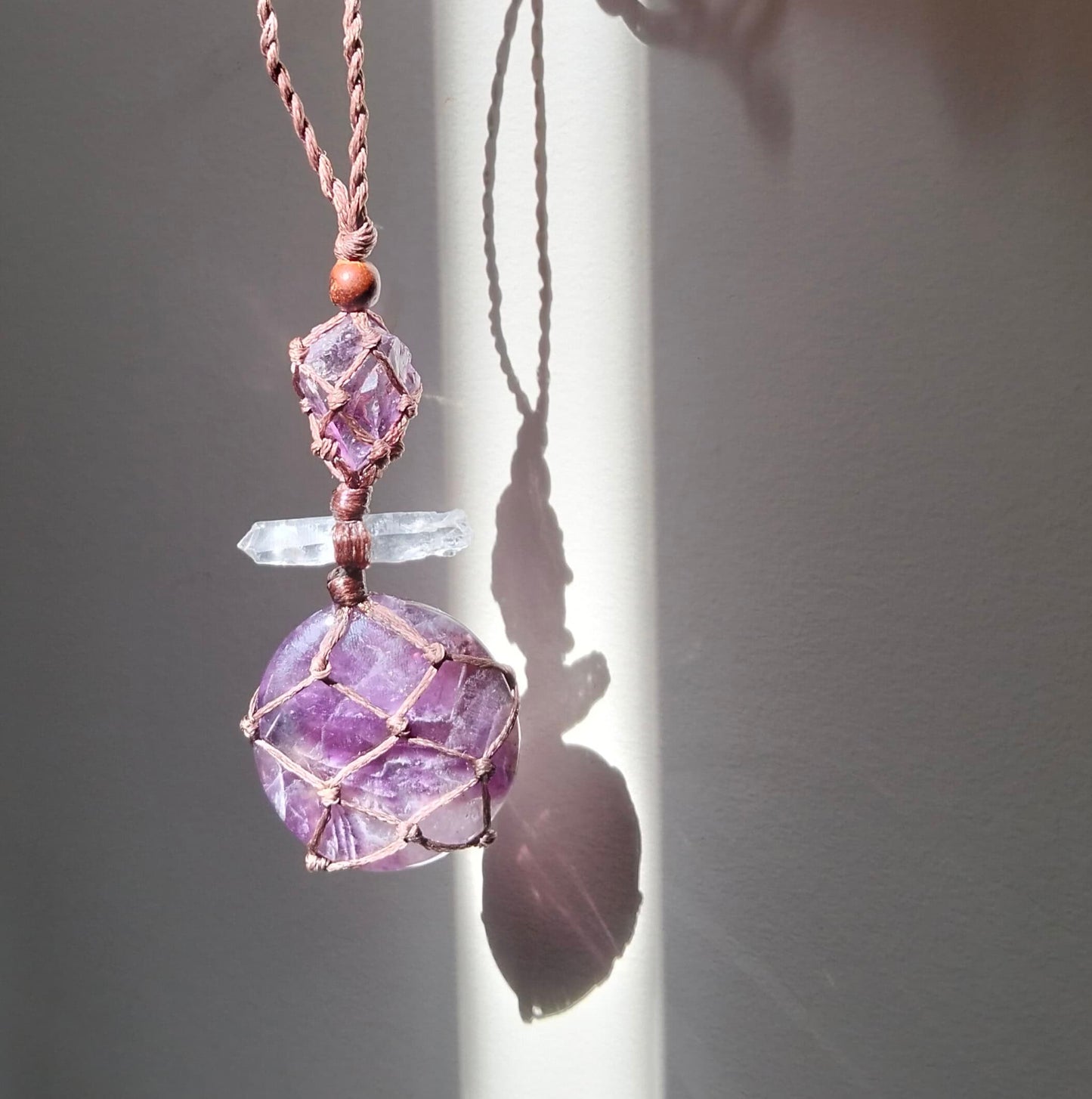 Talisman Necklace with purple chevron amethyst clear lemurian crystal  and an amethyst bead with a hand made twisted leather chord.