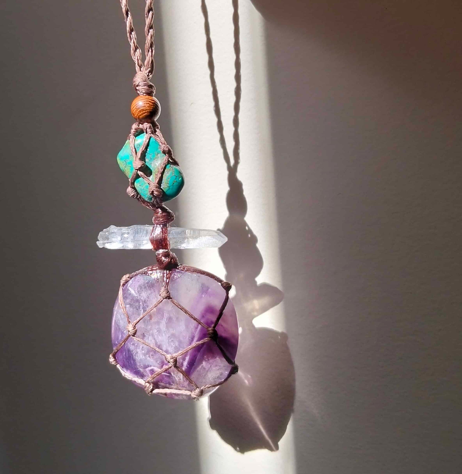 Necklace with Chevron Amethyst a clear Lemurian crystal and green Turquoise stone with handmade leather chord