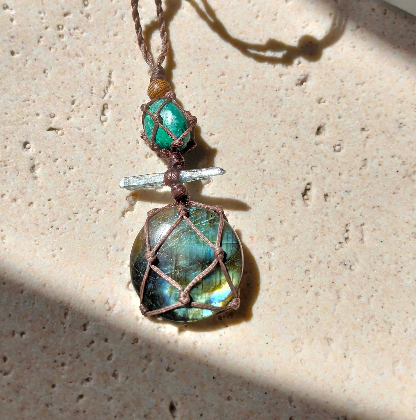 Talisman Necklace with a green blue labradorite stone pendant  with a pale blue kyanite crystal and a green Chrysocolla bead on a handmade twisted leather chord