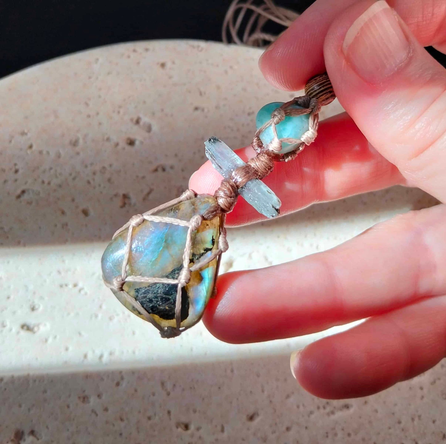 Talisman Necklace with blue green labradorite pale blue kyanite crystal and larimar bead with a handmade twisted leather chord