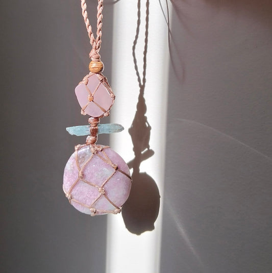 Talisman necklace with pink mauve Lepidolite, pale blue kyanite crystal and rose quartz with a hand made twisted leather chord