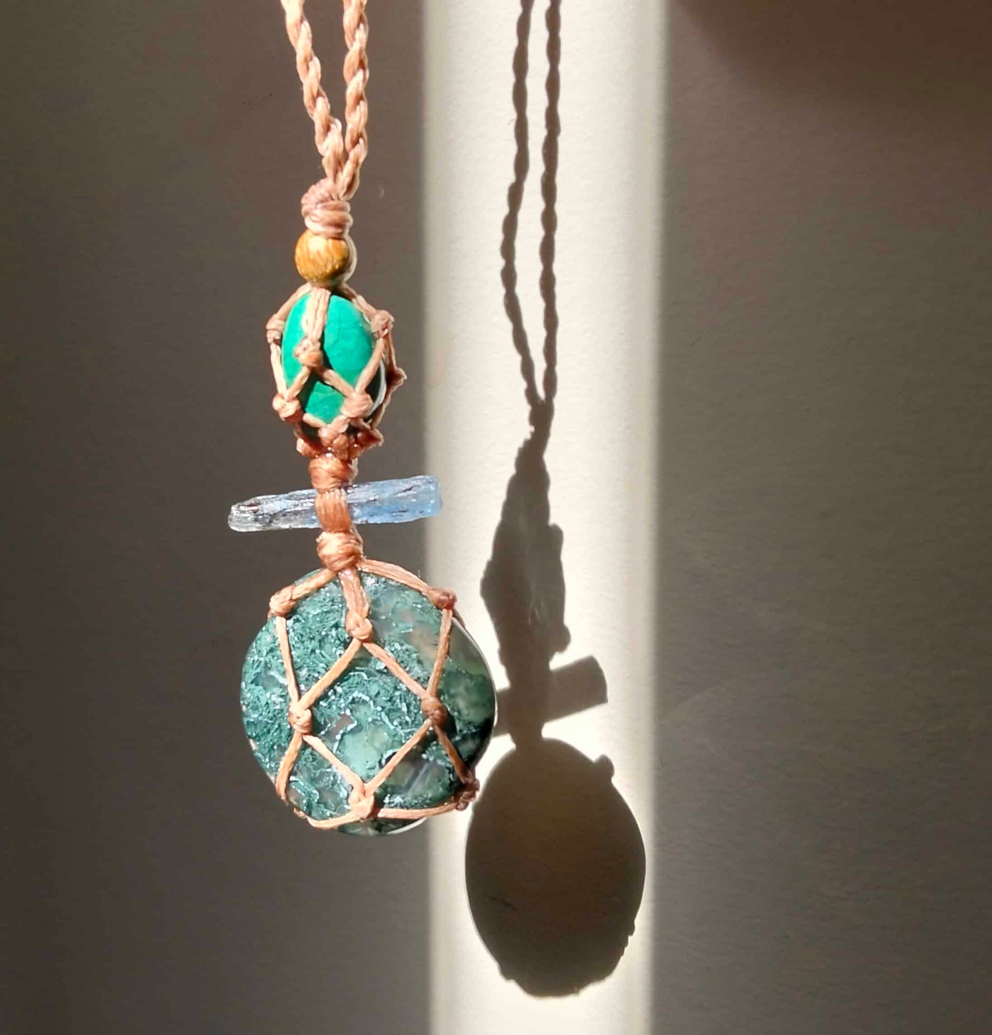 Moss Agate Necklace with pale blue kyanite crystal and Green chrysocolla bead and braided  leather chord.