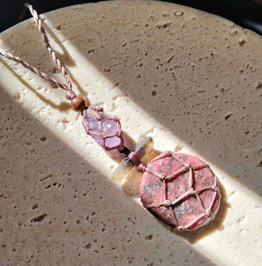 Talisman necklace with Rhodinite, smoky quartz crystal and amethyst on a handmade leather cord.