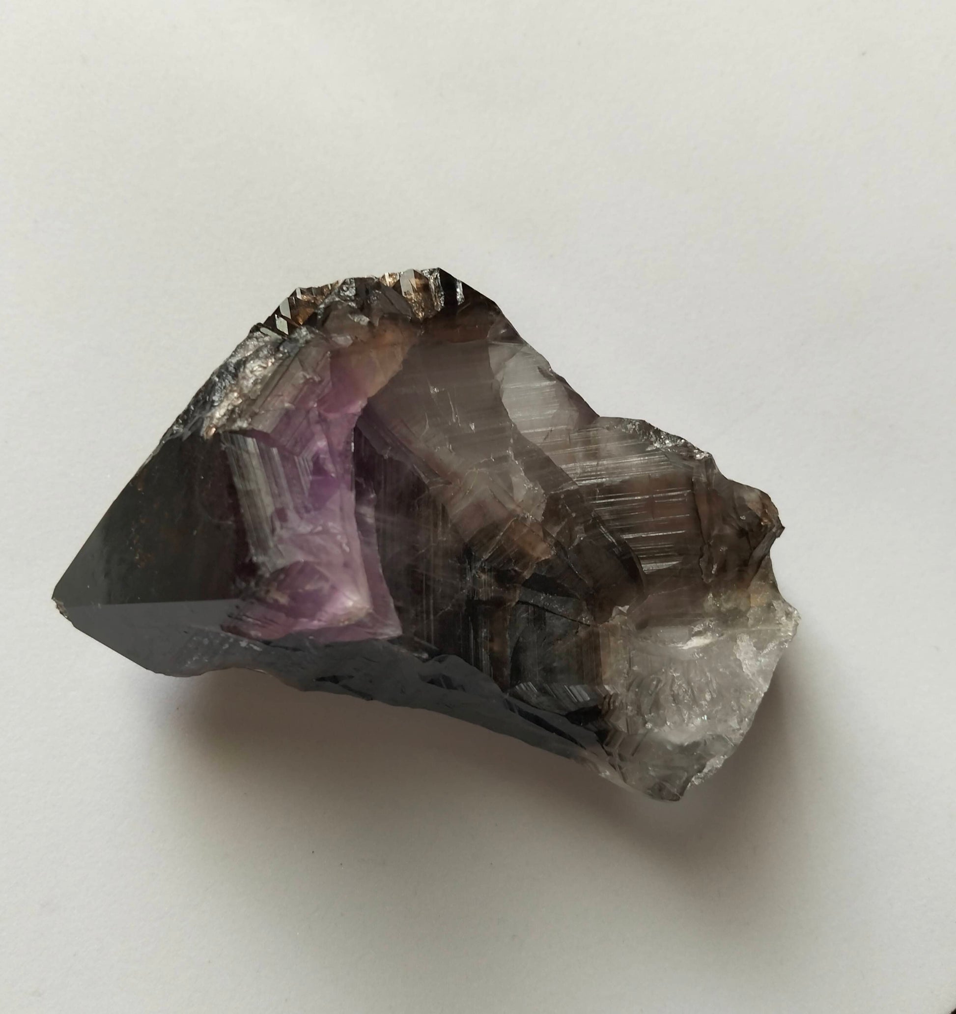 amethyst crystal, adorned with inclusions and zoning of smoky quartz and amethyst, showcase the unique geological processes at play. Unearthed from this distinctive Australian mine, each amethyst point holds a piece of history and inherent beauty.