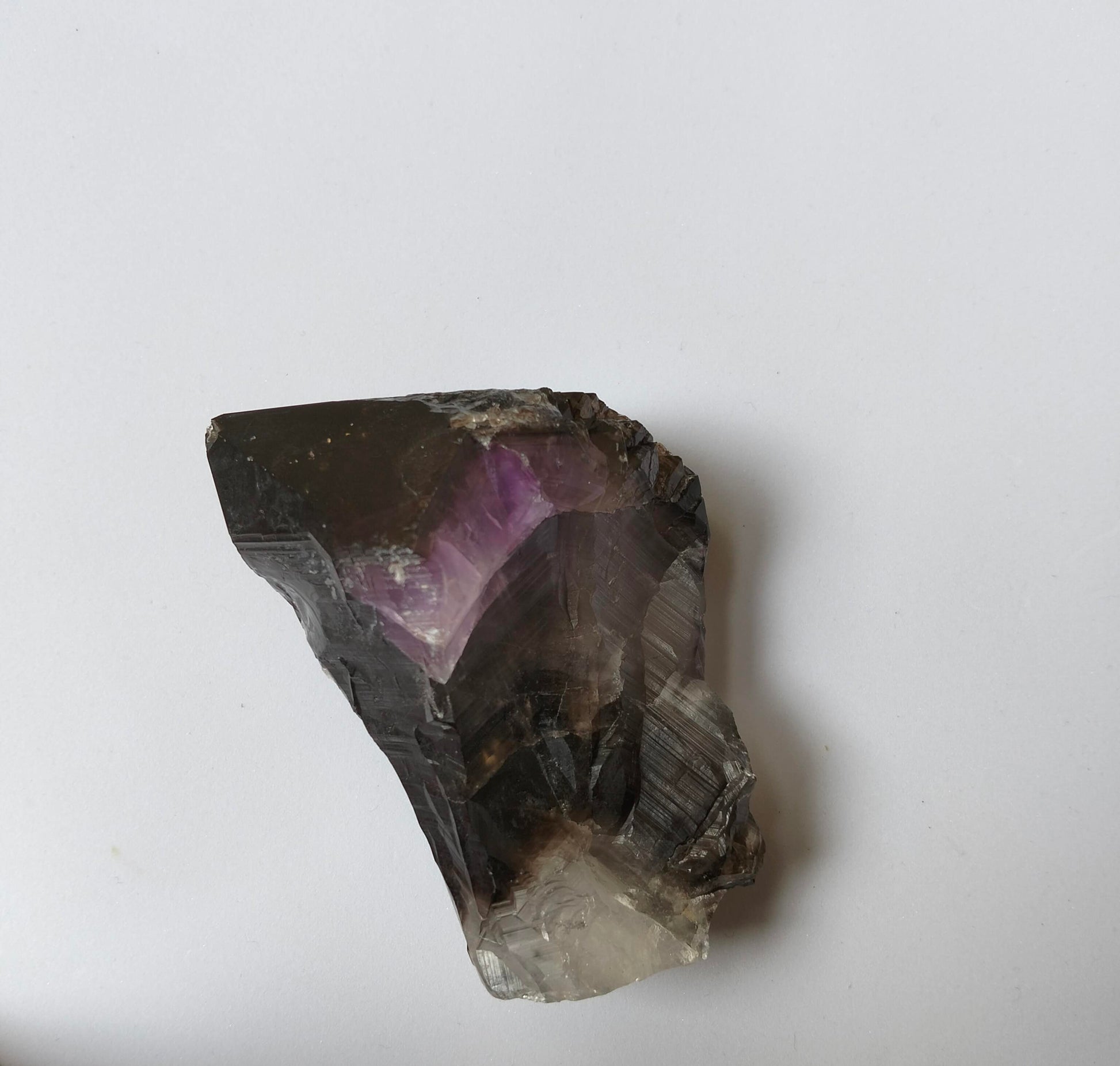 amethyst crystal, adorned with inclusions and zoning of smoky quartz and amethyst, showcase the unique geological processes at play. Unearthed from this distinctive Australian mine, each amethyst point holds a piece of history and inherent beauty.