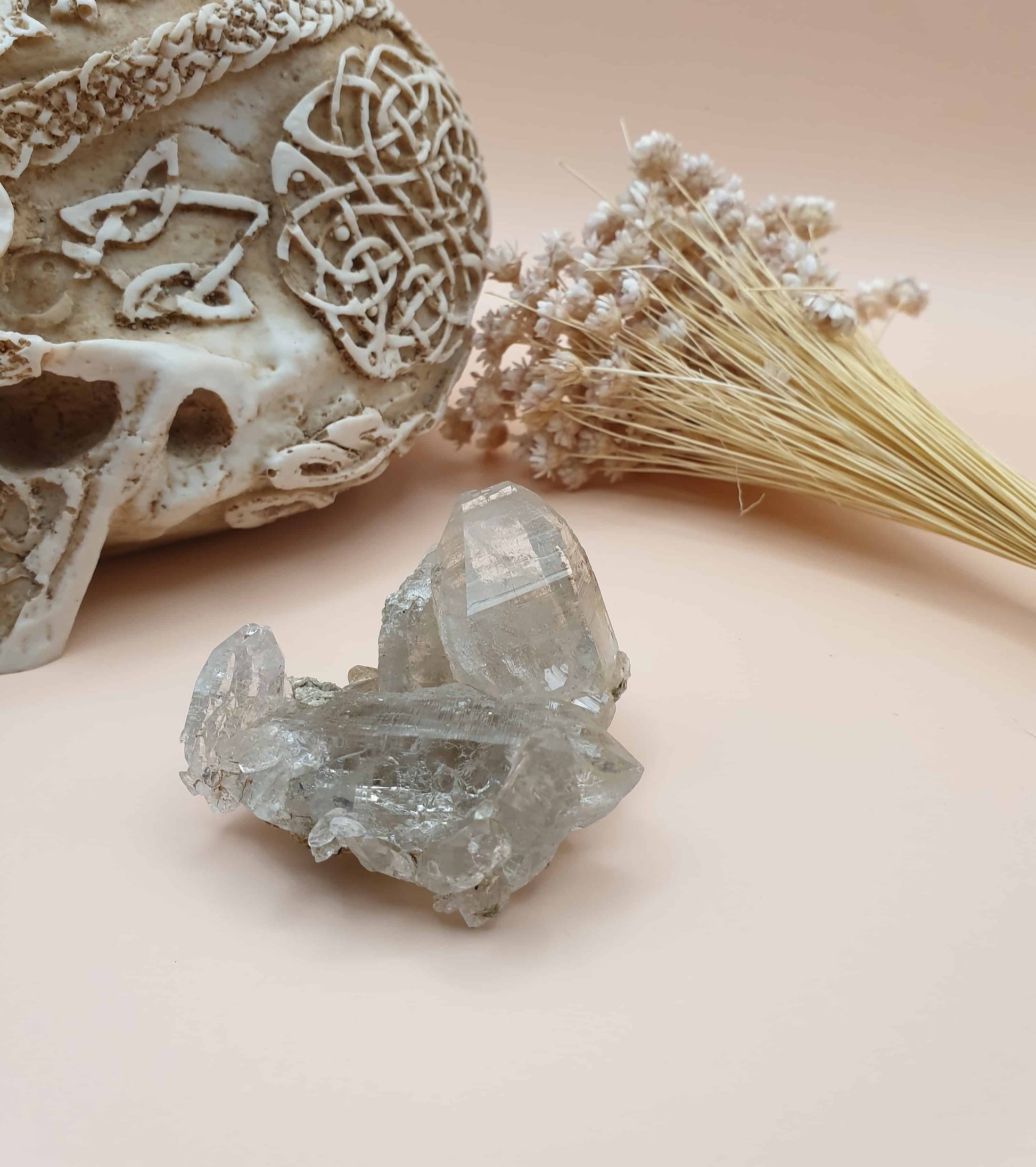 This stunning Ganesh Himal quartz natural cluster is hand mined by sherpas from the holy mountain Ganesh! This piece has beautiful mica inclusions. Mica is a principle rock forming mineral, that often has a shimmer and forms in layers.
