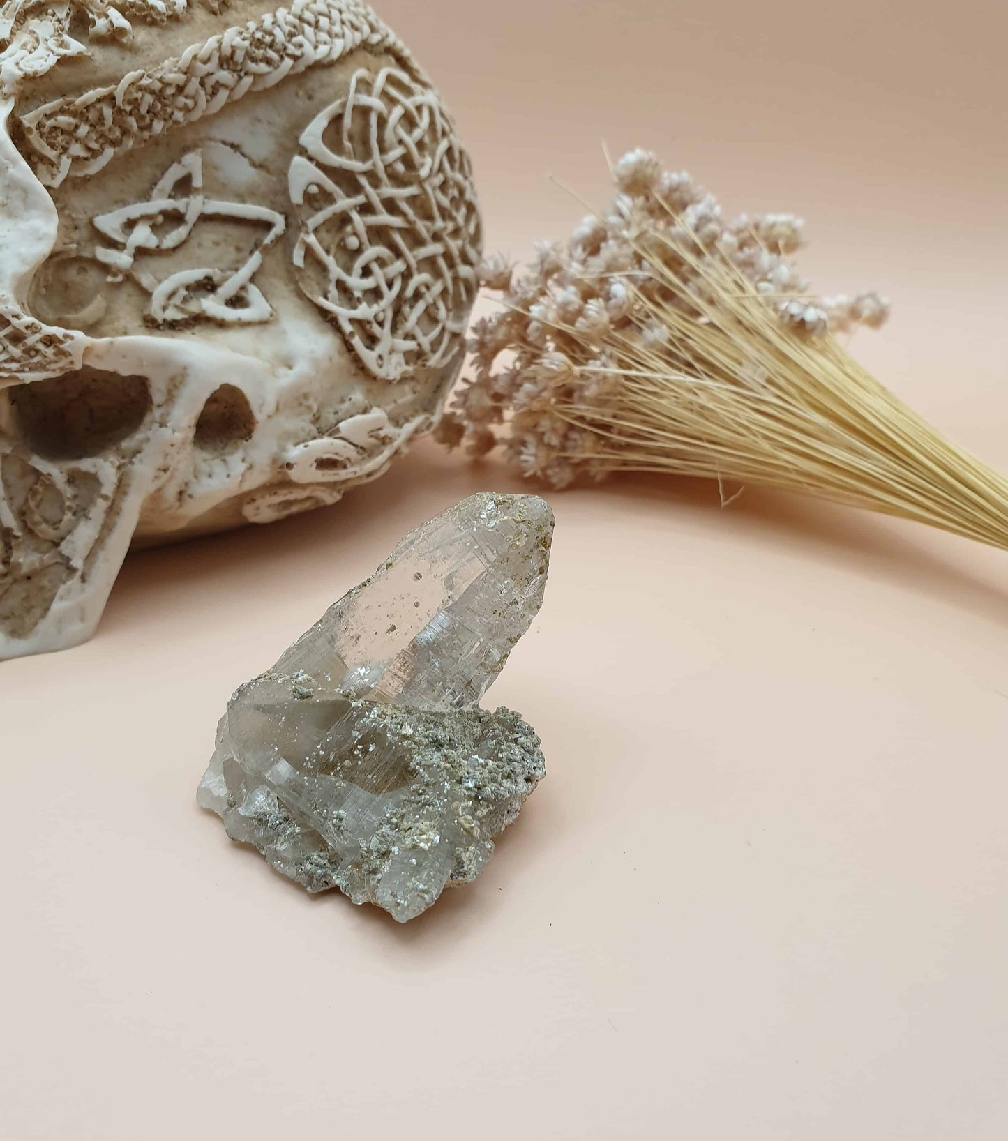 This stunning Ganesh Himal quartz natural point is hand mined by sherpas from the holy mountain Ganesh! This piece has beautiful mica inclusions, speckled on its surface. Mica is a principle rock forming mineral, that often has a shimmer and forms in layers.