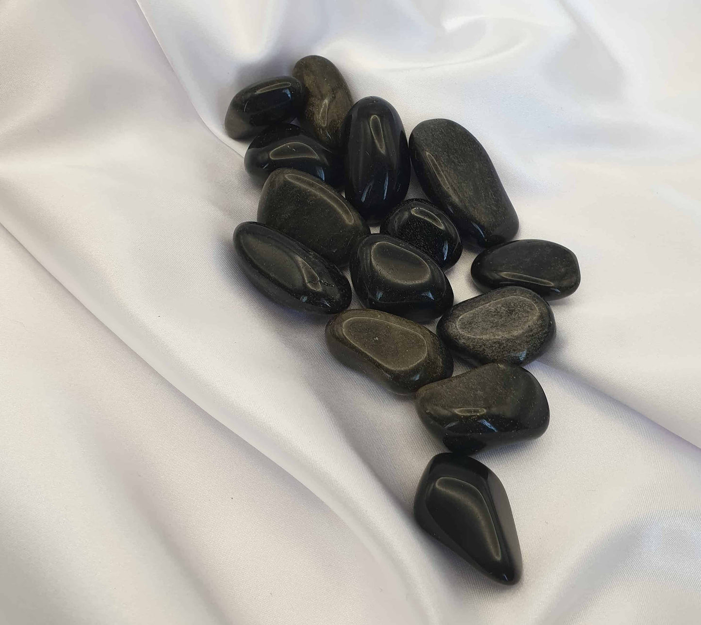 Gold Sheen Obsidian is said to help dissolve negative energy. These tumbled stones can help in releasing ego and balancing energy fields. This is an interesting stone as it is not thought to give energy but to help seekers discover where the healing needs to happen, this is why it is a popular stone with crystal healers.