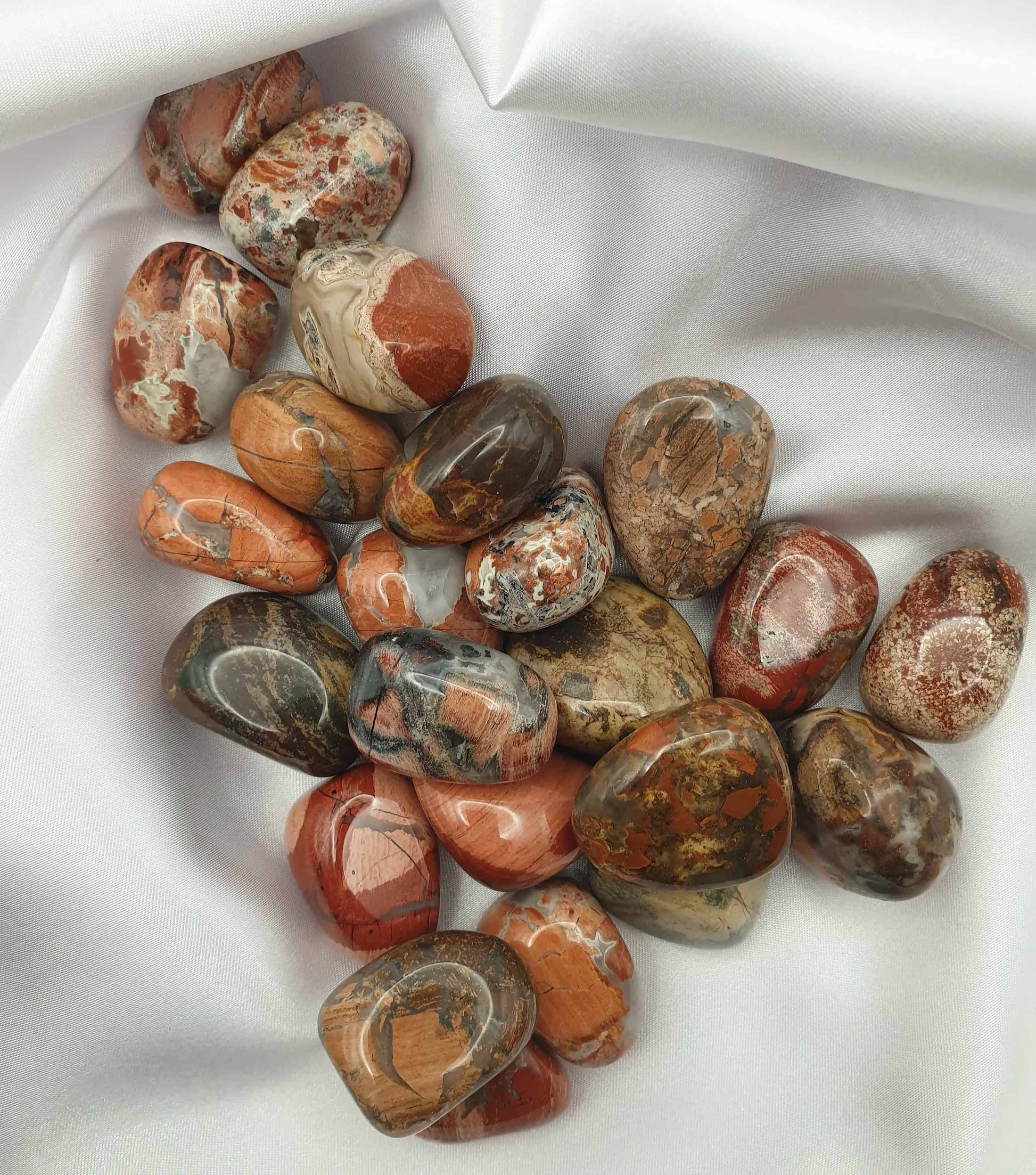 Poppy Jasper is a great grounding, revitalising, all purpose stone which can help to stimulate energy, mental activity and motivation. Poppy Jasper tumbled stones can assist in balancing the yin and yang and the patterns are amazing!