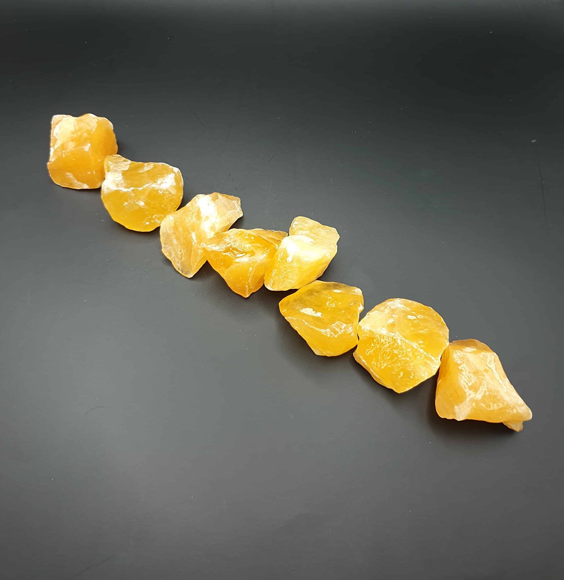 Origin - Mexico Chakra - Base, sacral Zodiac sign - Cancer  Orange calcite is considered to be a highly energising, cleansing and healing stone. It can assist with maximising creativity and potential, whilst balancing emotions and helping to alleviate fears.   Measurements are approximately 30 to 40mm Weight - 35 to 45 grams  One piece of rough orange calcite will be intuitively chosen for you